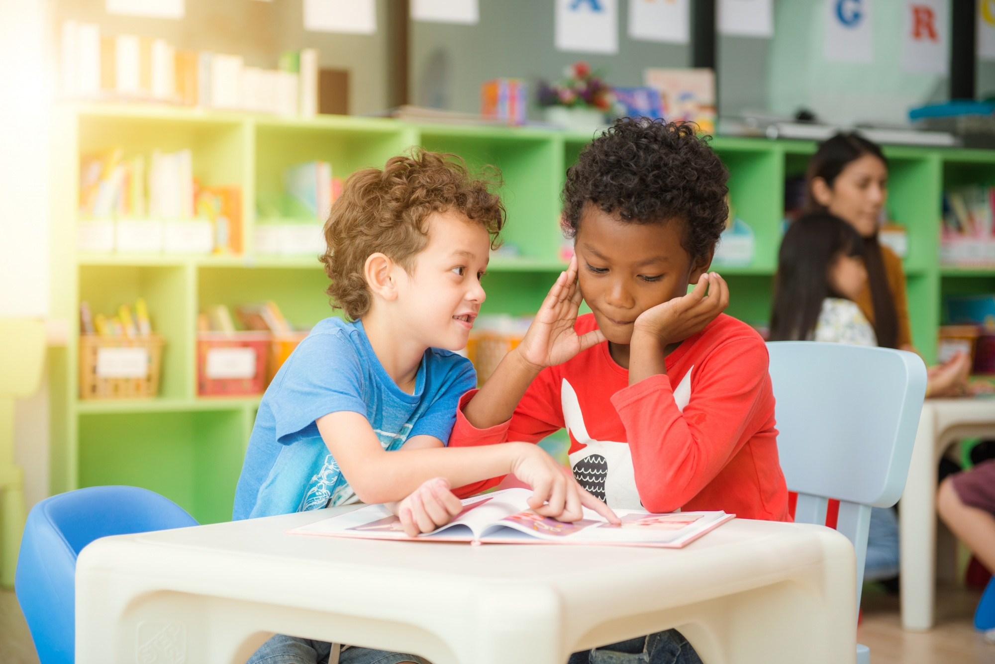 Children reading together at daycare - Kinderflow parent portal